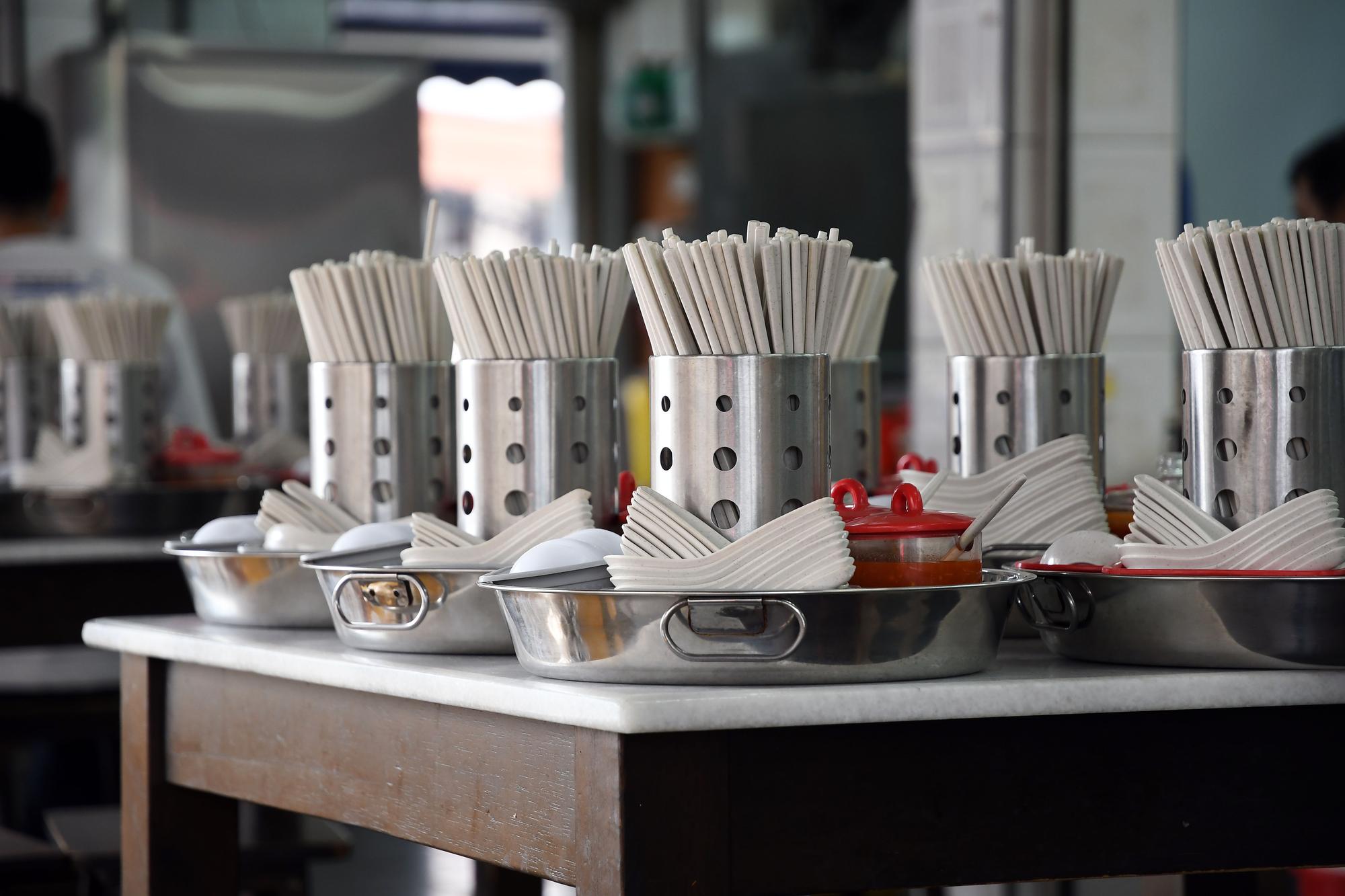 Small professional kitchen workspace with utensils